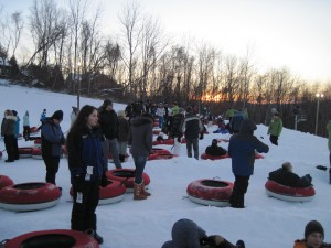 We join the lines waiting to go down the hill. Nice sunset in the background, right? Copyright Deborah Abrams Kaplan