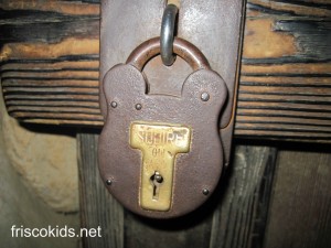 This is one of my favorites. It's on Pirate Lair island inside one of the caves. You'll also find one of these locks outside the Pirates of the Carribbean ride, on the store door as you exit.