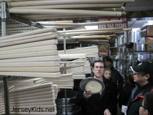 Here you can see Scott with the many pizza peel sizes, holding a pan which is supposed to be a pizza.