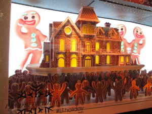 Gingerbread men holding the gingerbread mansion. Copyright Deborah Abrams Kaplan