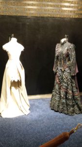 The original Elphaba costume (right) and the reimagined Glinda costume (by a Project Runway designer) on left.