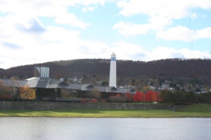 Corning's well-known tower with a picture of a gaffer on top. In the foreground is the corporate office for Corning Glass.